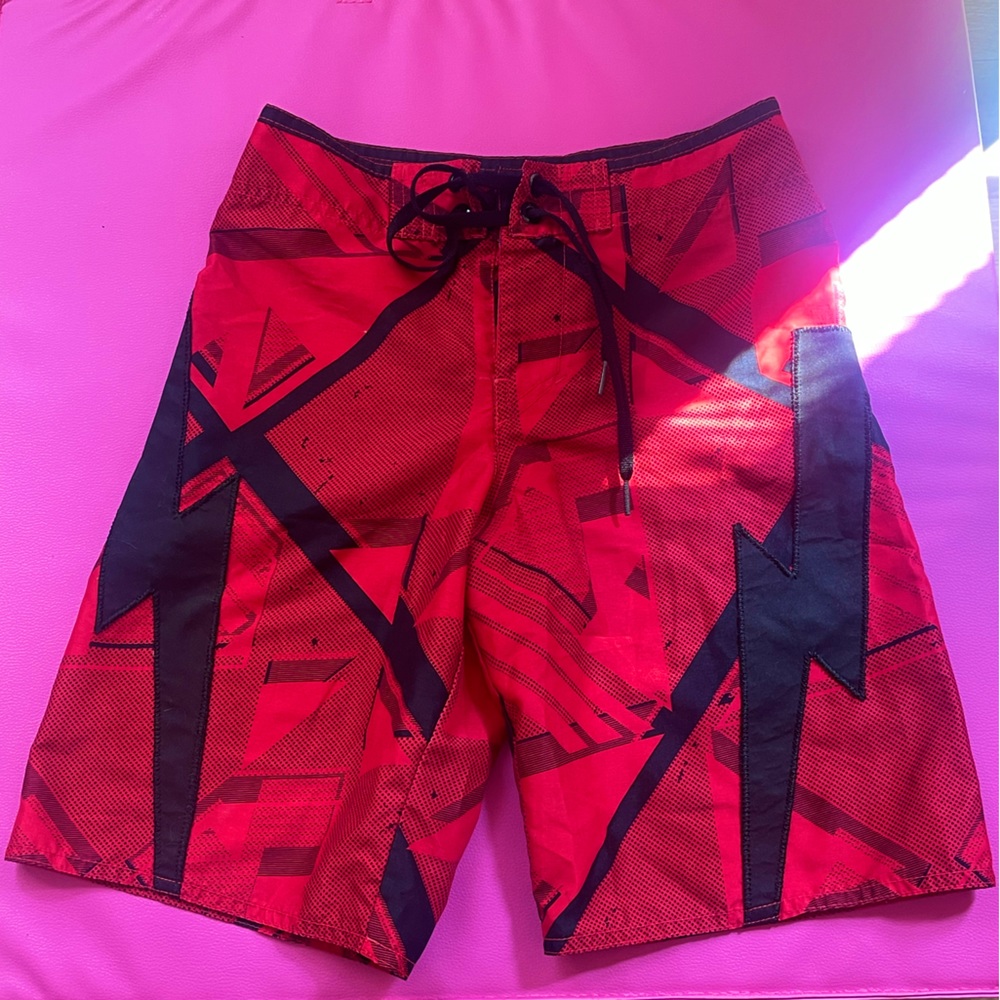 red and black boy tony hawk swim trunks